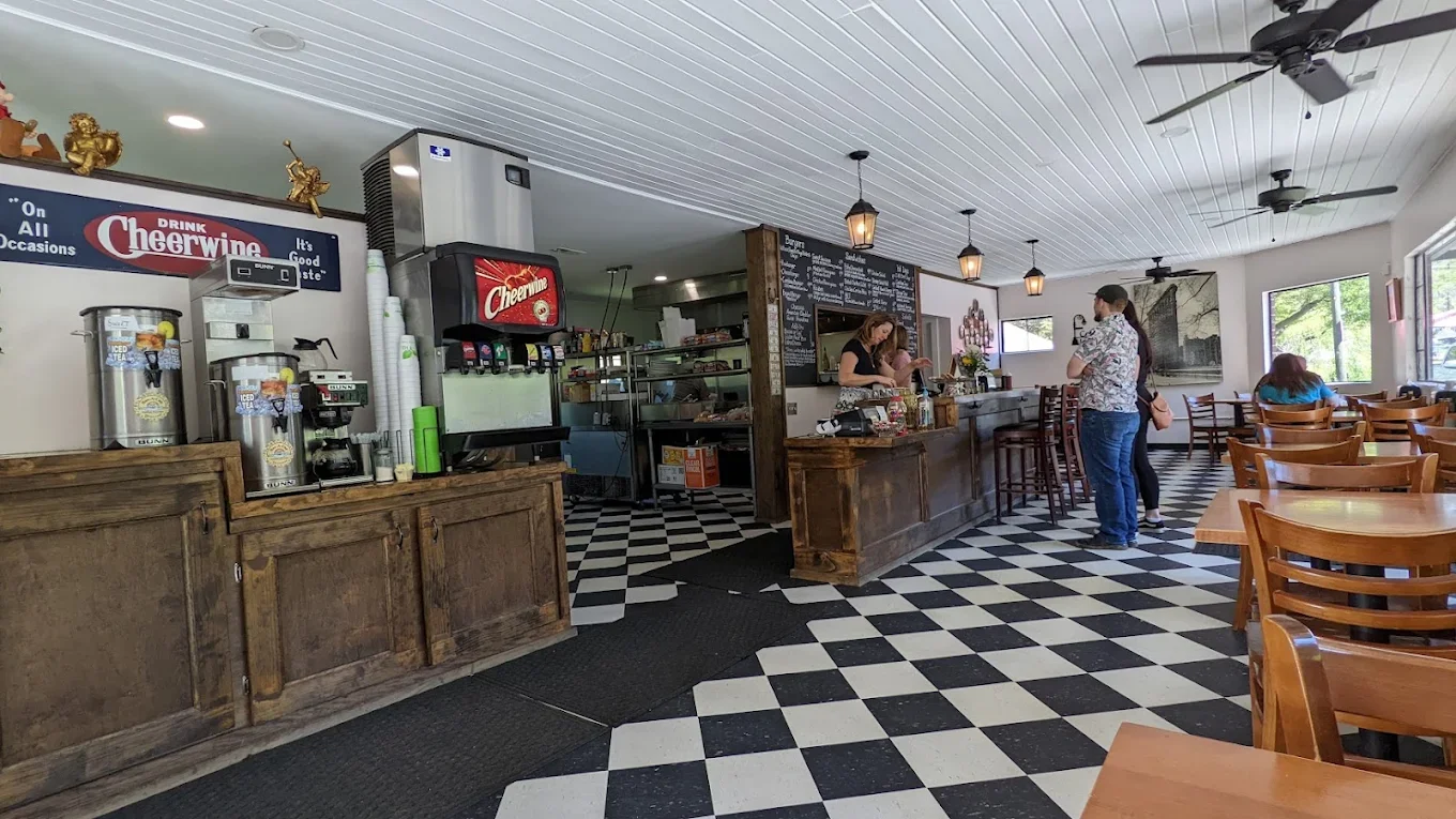 Inside Centreville Luncheonette — wide view of the dining room, counter, and chalkboard menu