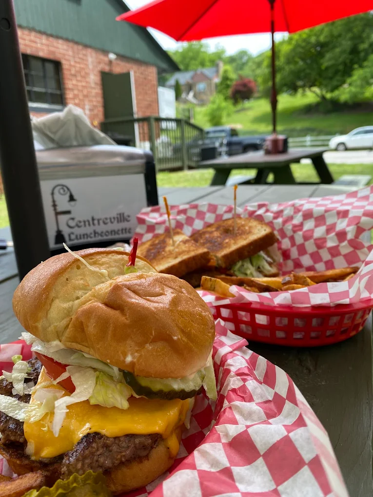 Cheeseburger and grilled cheese at the outdoor picnic table seating area of Centreville Luncheonette