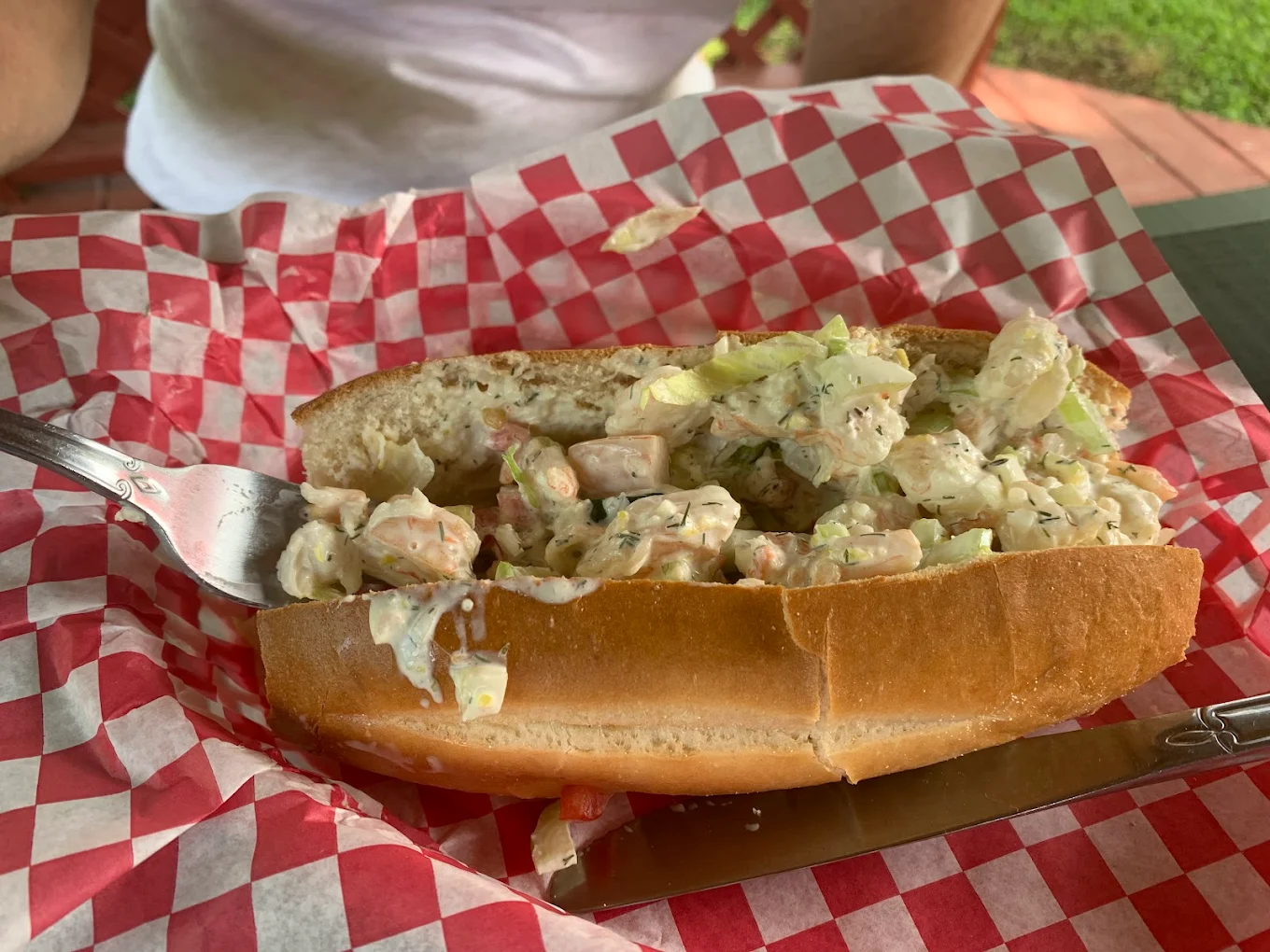 Shrimp Salad Roll on red and white checkered paper from Centreville Luncheonette
